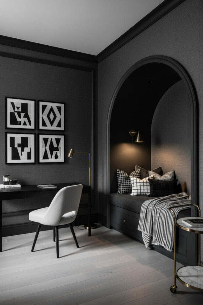 Charcoal and black workspace with daybed nook and brass accents showcasing efficient small moody home office setup ideas.